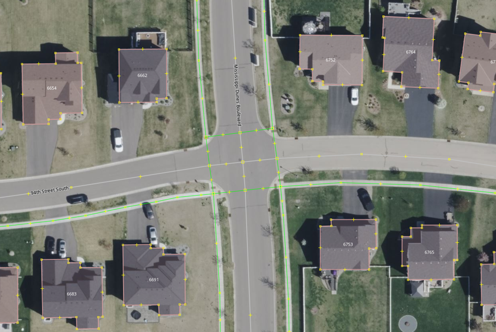 A screenshot of a map. The houses have house numbers, the sidewalks and crosswalks are mapped, and the streets are mapped